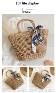 Detail of khaki straw tote bag with elegant nautical silk scarf wrapped on round handle
