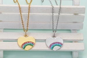 Rainbow heart pendant necklaces in gold and silver finishes with colorful gemstones