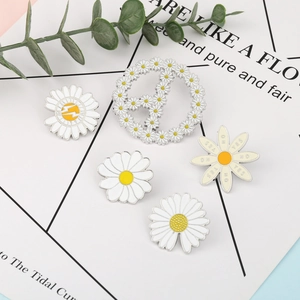 Five-piece daisy enamel brooch set with floral and peace signs on a stylish background
