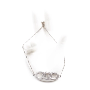 Adjustable silver bracelet with interlocking triple rings set with cubic zirconia stones
