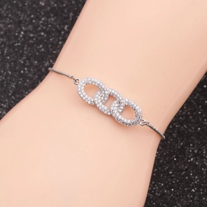 Silver infinity interlocking circle bracelet with pavé cubic zirconia on wrist
