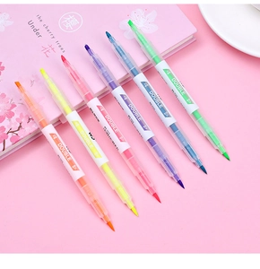 Set of 6 double-ended highlighters in assorted colors on a cherry blossom notebook