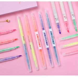 Detail of dual-tip highlighters showing broad and fine nibs in vibrant assorted colors