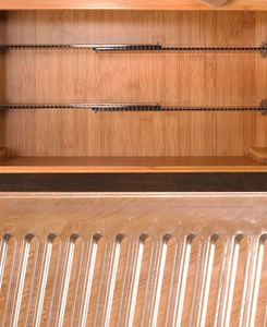 Adjustable bamboo drawer divider featuring transparent ribbed panels and sliding mechanism