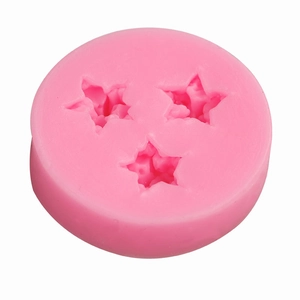 Pink silicone mold with three star-shaped cavities for DIY baking and craft projects