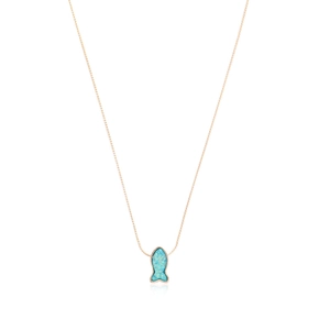 Close-up of rose gold chain and mermaid pendant with colorful blue opal inlay