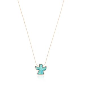 Macro shot of rose gold necklace featuring a blue opal angel pendant on a white background