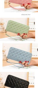 Detail of long quilted women's zip wallets with crown embossing in various colors