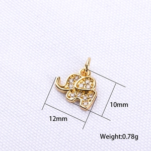 Macro shot of 12x10mm gold elephant charm pendant with zircon inlays and dimensions