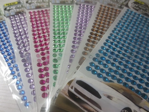 Close-up of 3mm self-adhesive acrylic gemstone stickers in assorted vibrant colors
