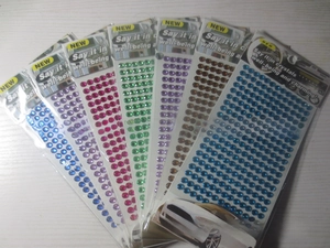 Close-up of multicolored 3mm self-adhesive acrylic rhinestone sticker sheets for DIY crafts