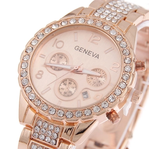 Close-up of Geneva rose gold watch with crystal bezel and decorative triple sub-dials