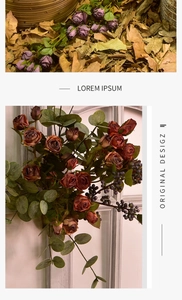 Detail of vintage artificial roses with burnt edges, eucalyptus leaves and berries décor