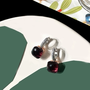 Detailed macro view of S925 silver square wine red gemstone earrings with diamond pavé