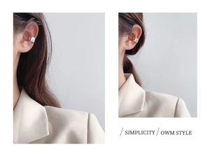 Detailed close-up of U-shape ear cuffs in gold and silver finish with twisted texture