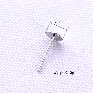 Macro detail of 5mm S925 sterling silver flat pad earring posts for DIY jewelry making