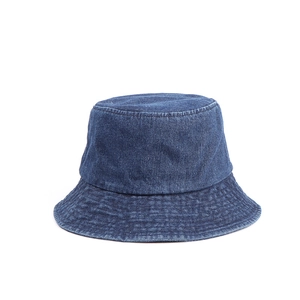 Detailed view of the dark blue denim fisherman hat with vintage contrast stitching