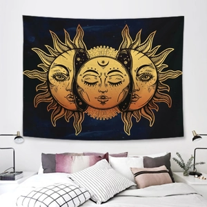 Detailed close-up of Bohemian sun and moon tapestry hanging over a minimalist bed setup
