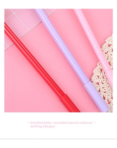 Macro shot of smooth matte finish pens in pastel red, purple and pink tones
