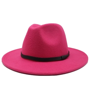 Close-up of rose red wool fedora hat featuring a wide brim and minimalist black band