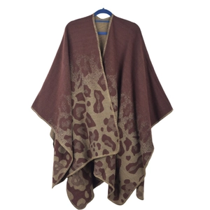 Detailed view of leopard print knit shawl with high-quality edge stitching for winter