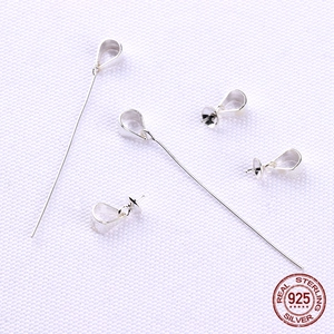 S925 sterling silver pinch bails for jewelry DIY on white fabric background