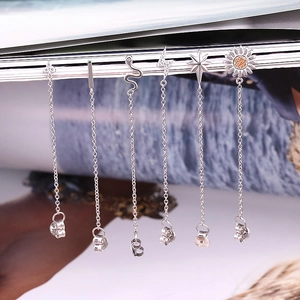 Detail of six S925 silver fringe earrings featuring star and lightning bolt pendants