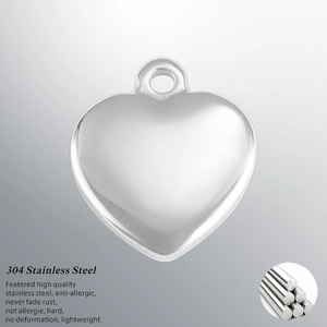 Macro view of 14mm 304 stainless steel heart pendant showing smooth polished metal texture