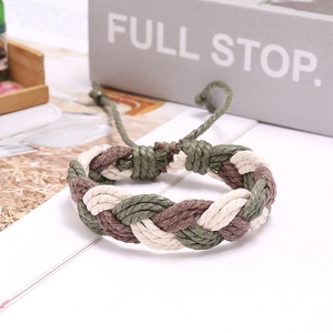 Detail of handmade woven rope bracelet featuring tri-color braided texture and adjustable knot