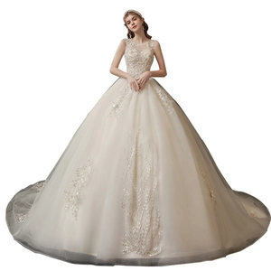 Elegant ivory off-shoulder wedding dress with lace bodice and voluminous tulle skirt
