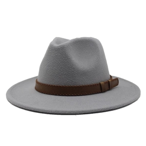 Detail of grey wool fedora hat featuring a brown leather band with braided stitching