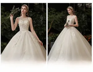 Detail of delicate floral embroidery and lace on the bodice of a white bridal gown