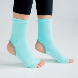 Light blue open toe and open heel yoga socks with white non-slip grippers on sole