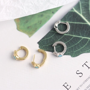 Detailed shot of S925 sterling silver hoop earrings with blue zircon and metal finish
