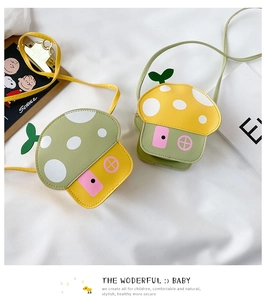 Detail of mushroom-shaped kids crossbody bag in yellow and green PU leather