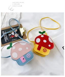 Detailed view of mushroom-shaped crossbody bags for kids in colorful faux leather finish