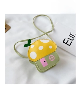 Detail of cartoon mushroom shaped crossbody bag for kids with yellow polka dot roof