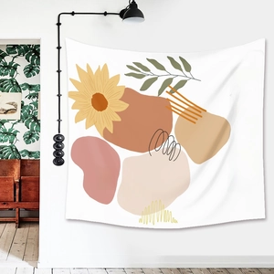 Detail of bohemian tapestry with sunflower motifs and abstract geometric color blocks