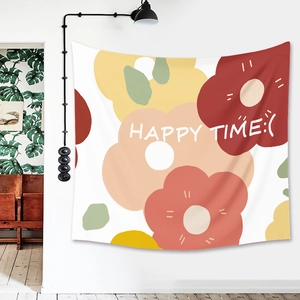 Detail of bohemian tapestry featuring colorful floral patterns and HAPPY TIME text print