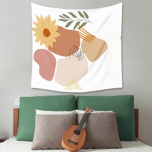 Bohemian tapestry with sunflower design and artistic text in a cozy bedroom setting