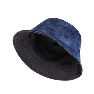 Deep blue washed denim bucket hat with tie-dye pattern and reversible black lining