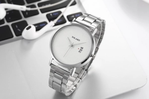 Close-up of YOLAKO men's watch featuring a white dial, blue hands, and silver mesh band