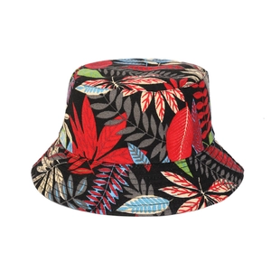 Black canvas bucket hat featuring vibrant tropical leaf print for outdoor travel wear