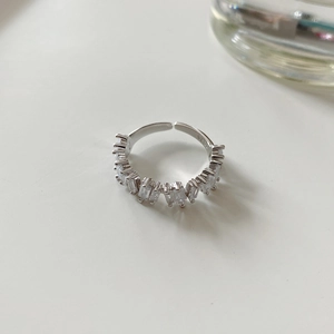 Detailed macro view of S925 sterling silver band with baguette-cut cubic zirconia setting