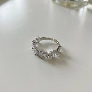 Macro shot of S925 sterling silver stamp and baguette cut cubic zirconia on the ring