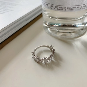 Macro shot of 925 silver ring featuring rectangular baguette cut cubic zirconia gems