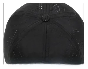 Detail of breathable mesh holes and reinforced top stitching on black baseball cap