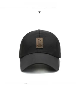 Detail of breathable black mesh fabric and premium brown leather patch on baseball cap