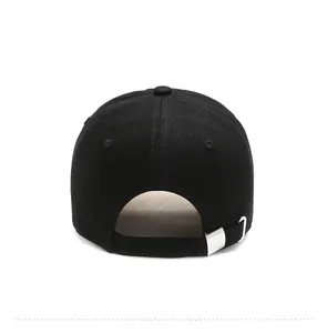 Detail of black cotton baseball cap back with adjustable silver metal buckle strap