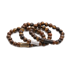 Ensemble de trois bracelets en perles d'œil de tigre avec accents de zircon or, argent et noir
